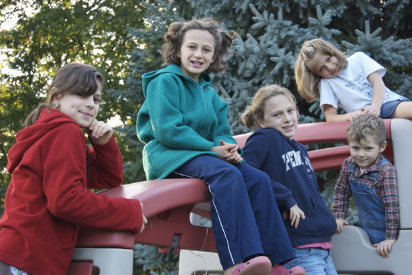 family portrait on swing set